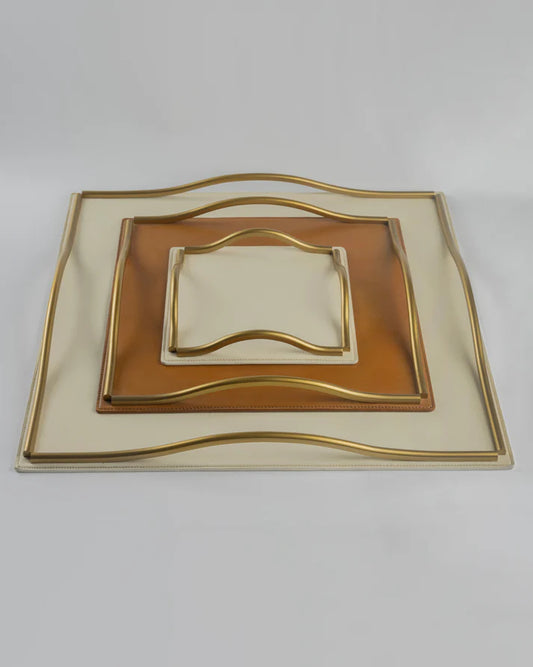 Decorative square plate with gold rim on a white background
